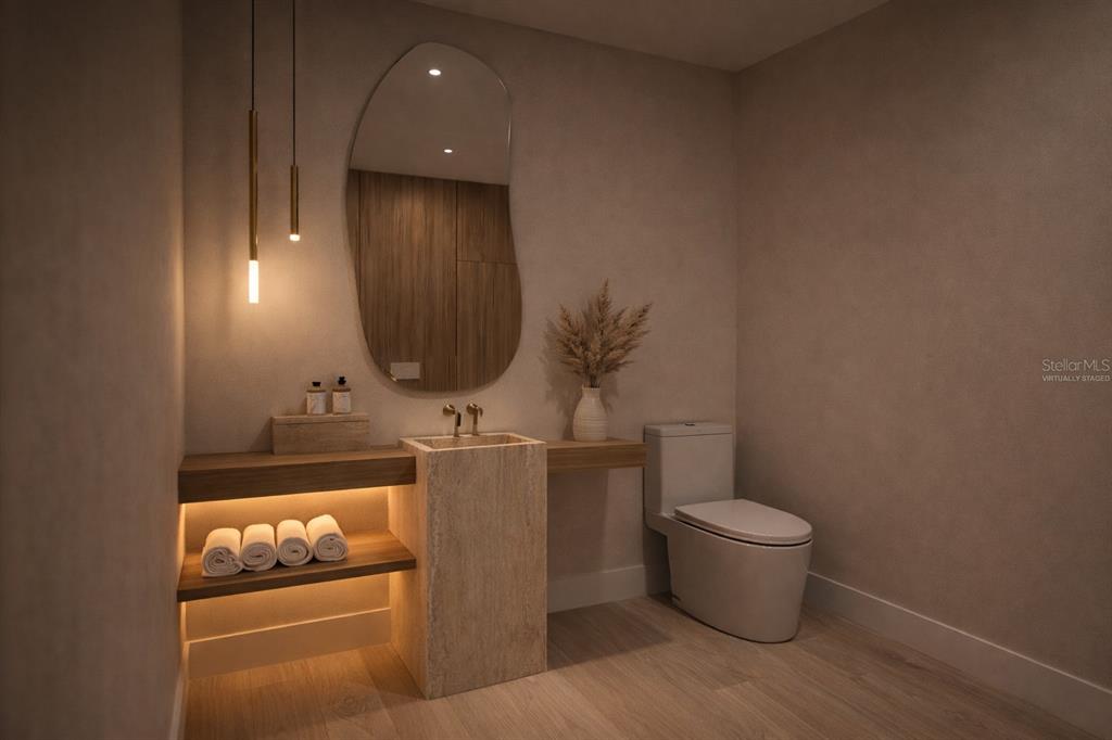 581 Hibiscus Way Longboat Key, FL 34228 - Photo 5 of 12 a bathroom with a toilet and mirror