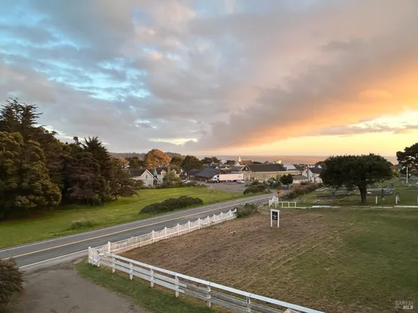 a spacious bathroom with a double vanity sink a mirror and a bathtub