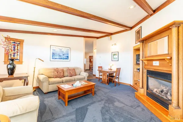 a spacious bedroom with a bed and a large window