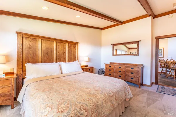 a view of an empty room and wooden floor