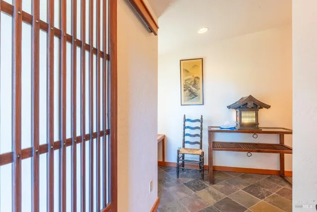 a kitchen with stainless steel appliances granite countertop wooden floors and white cabinets
