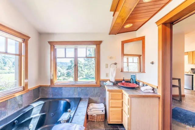 a living room with a large window and table