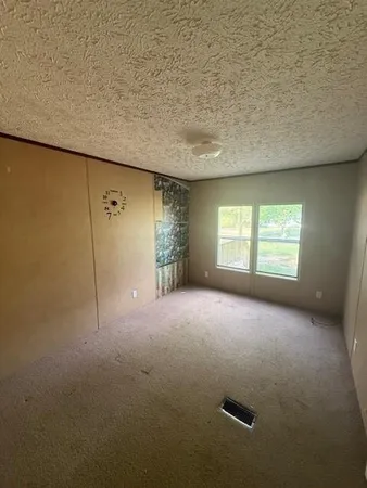 a view of empty room with windows