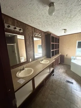 a room with pool table and windows