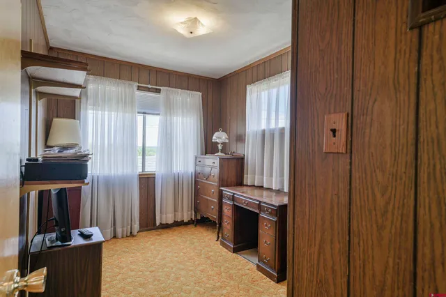 a view of a kitchen from the hallway