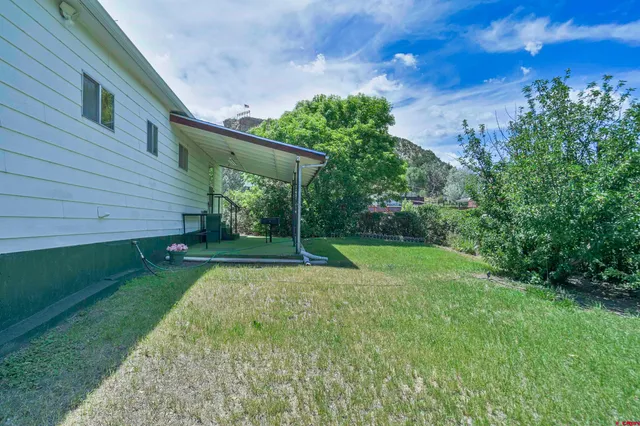 a view of a backyard with a garden