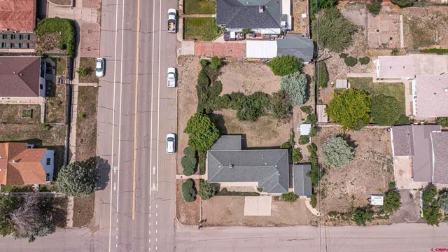 an aerial view of residential houses with outdoor space