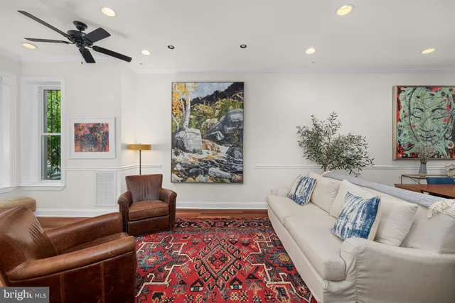 a living room with furniture and a rug