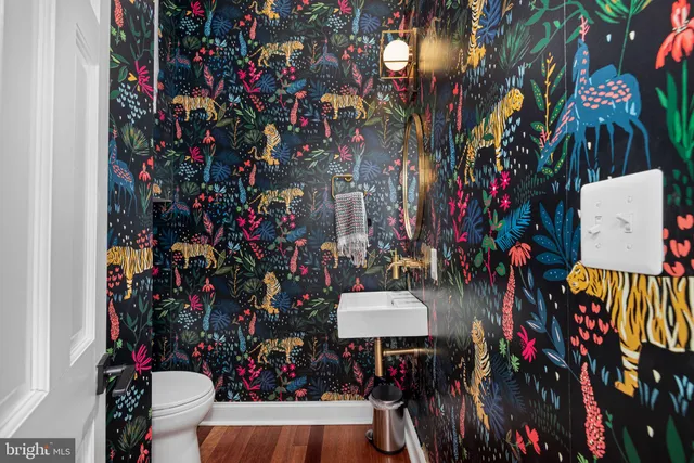 a bedroom with a bed window and a flat screen tv