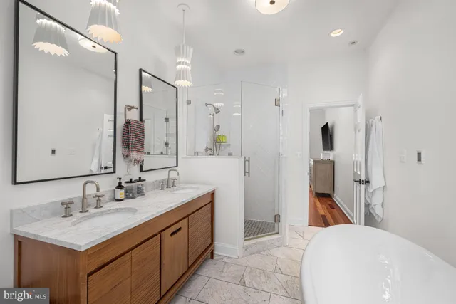 a bedroom with two beds and a window