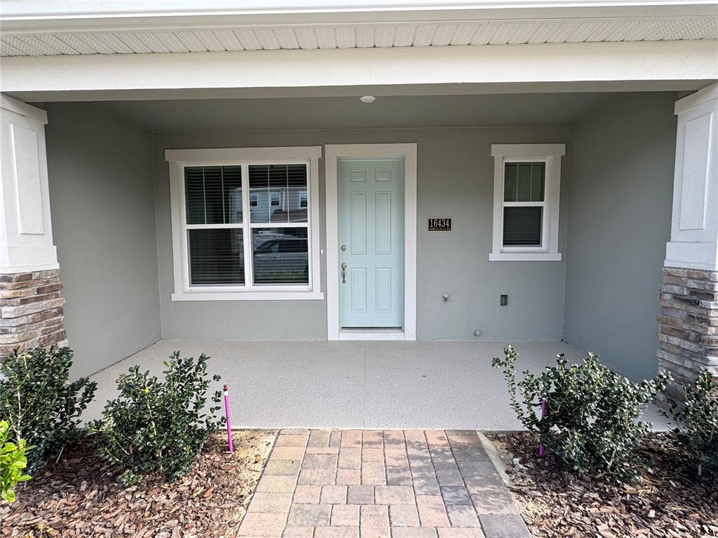 16434 Hamlin Hills Road Winter Garden, FL 34787 - Photo 3 of 50 a front view of a house with a yard
