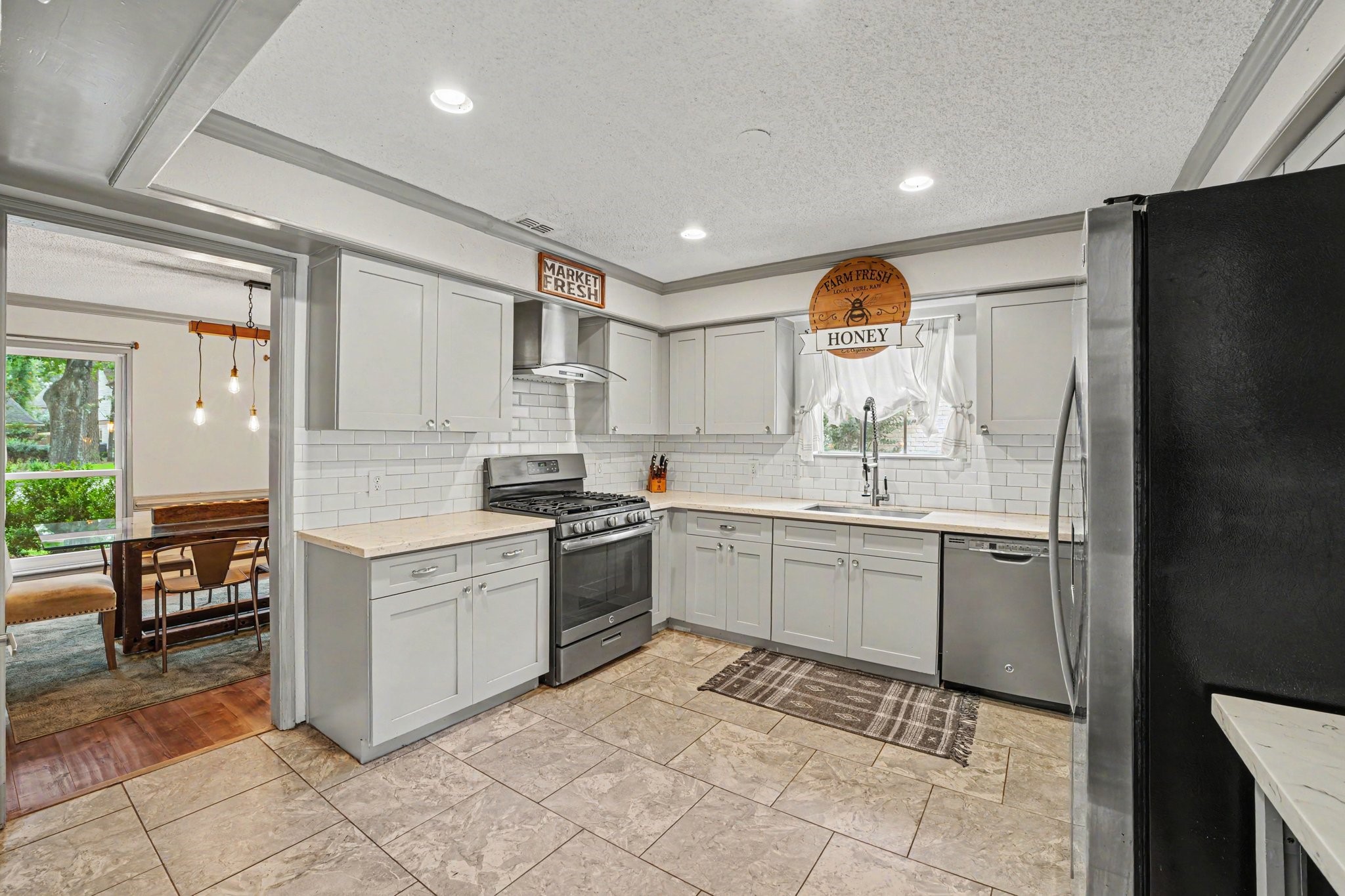 9530 Arcade Drive Spring, TX 77379 - Photo 12 of 32 Chef’s dream kitchen showcases stunning countertops, bright cabinetry, and stainless steel appliances.