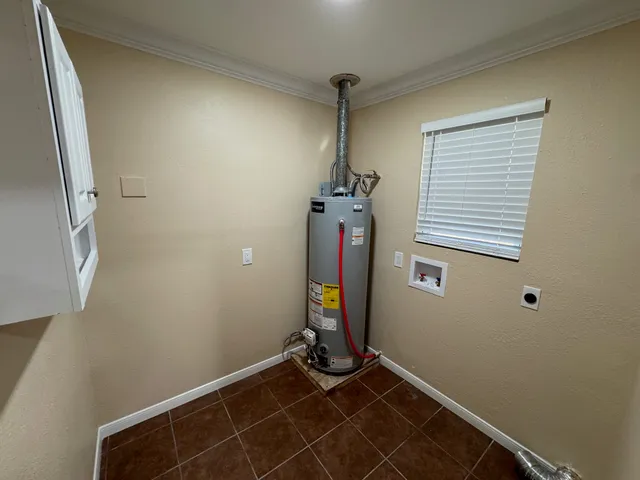 a view of room with stairs and wooden floor