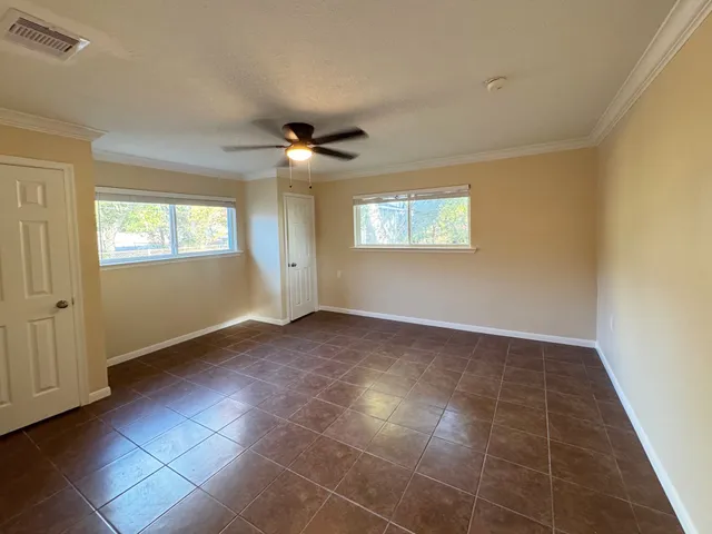 a view of an empty room with a window