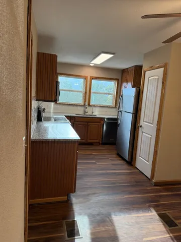 a bathroom with a sink a mirror and shower