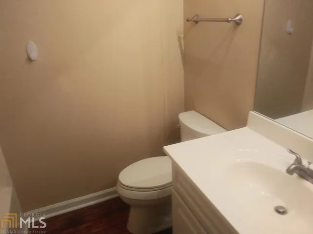 a bathroom with a sink and toilet