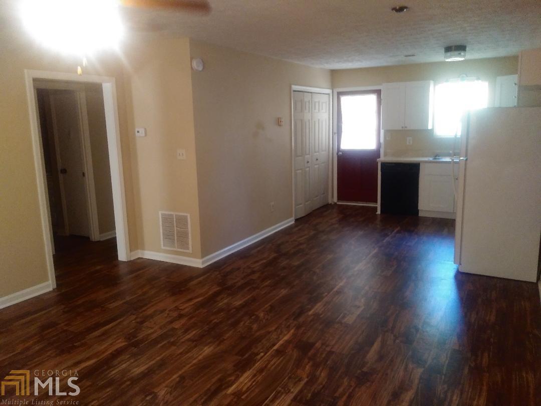 82 Paris Circle, Unit A Hiram, GA 30141 - Photo 10 of 12 a view of a kitchen with wooden floor and electronic appliances