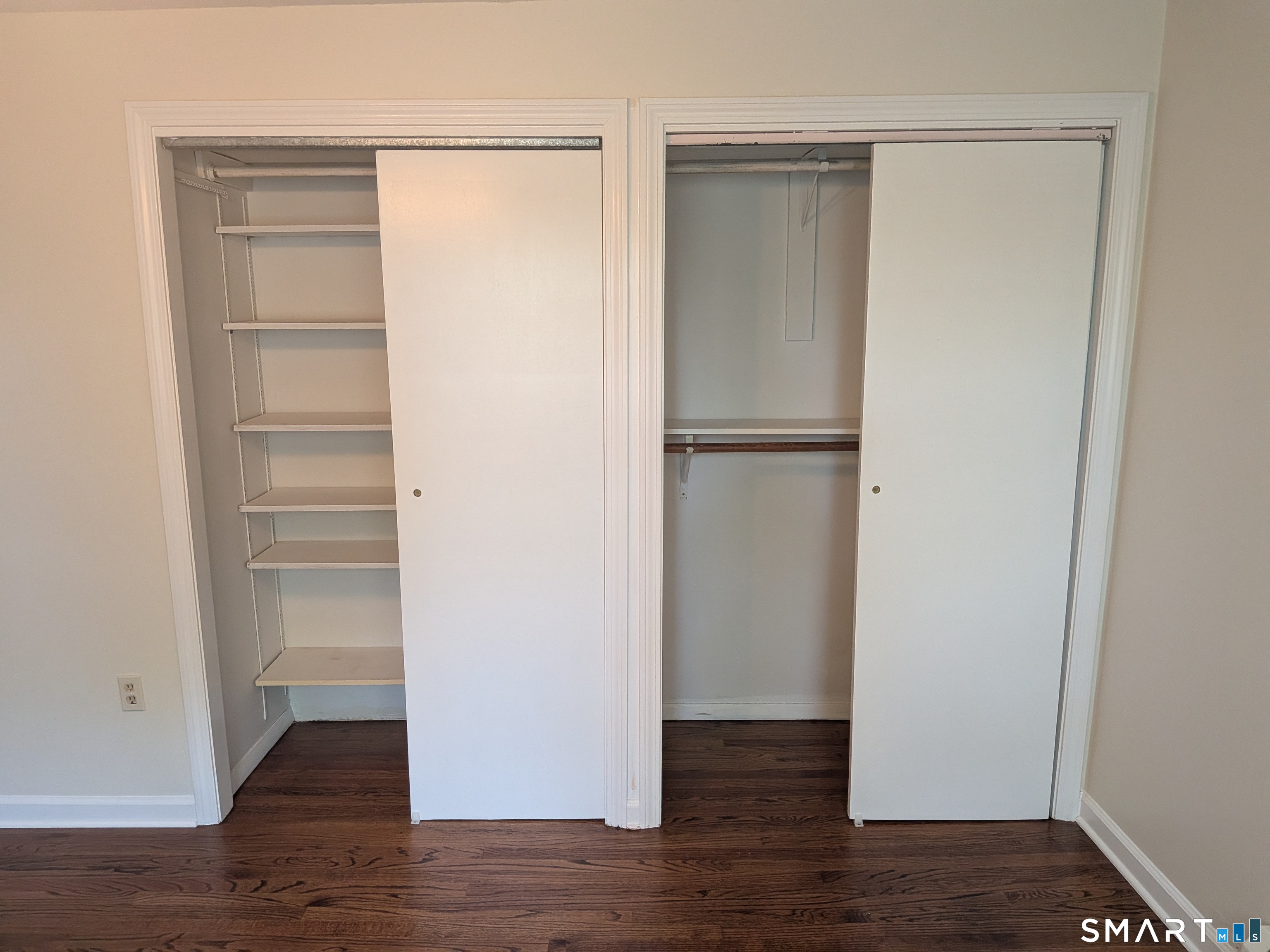 124 Spring Lake Road Waterbury, CT 06706 - Photo 15 of 34 Open closets in Primary bedroom.