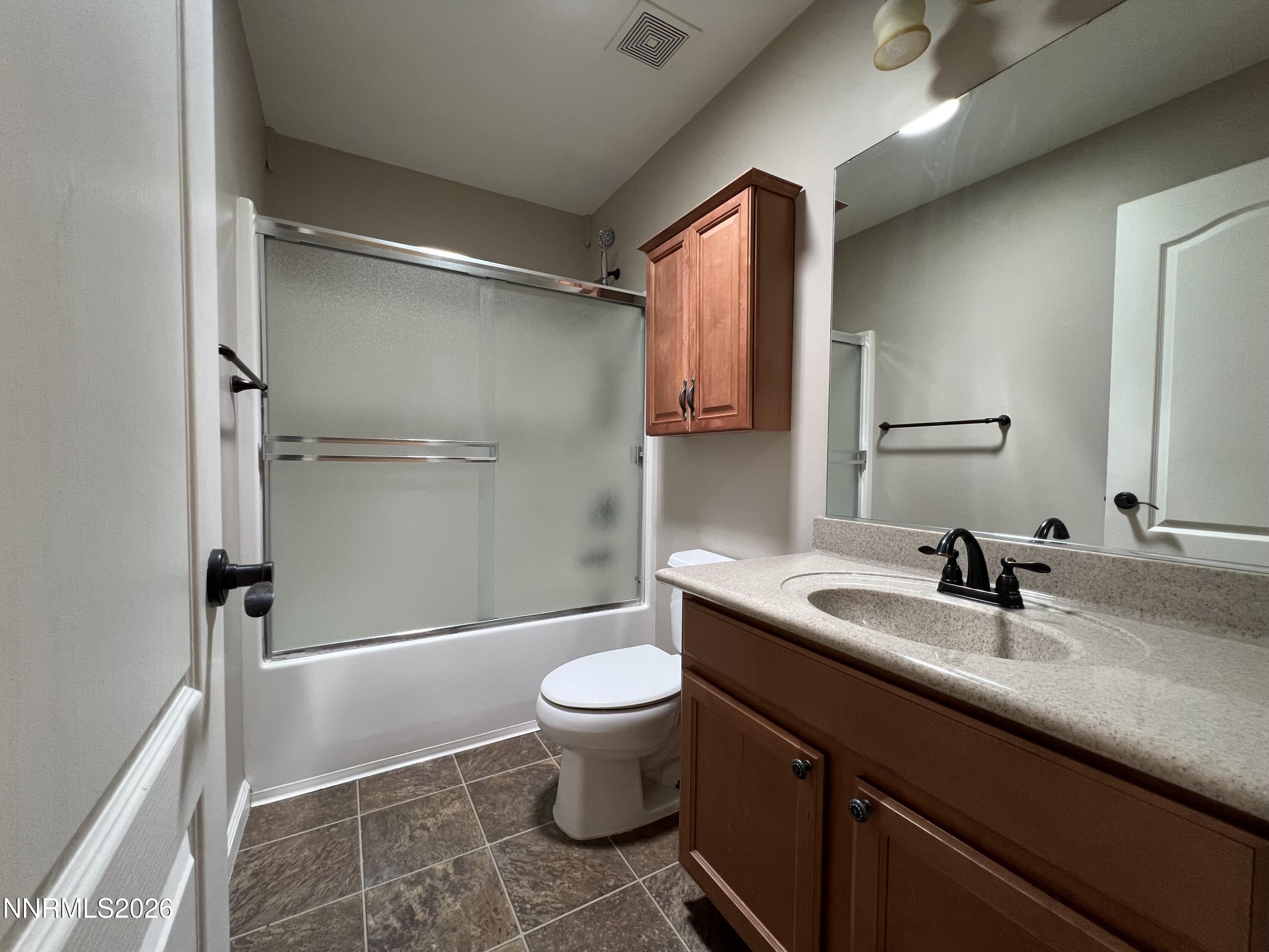 18406 Teddy Bear Court Reno, NV 89508 - Photo 29 of 44 a bathroom with a sink toilet and shower