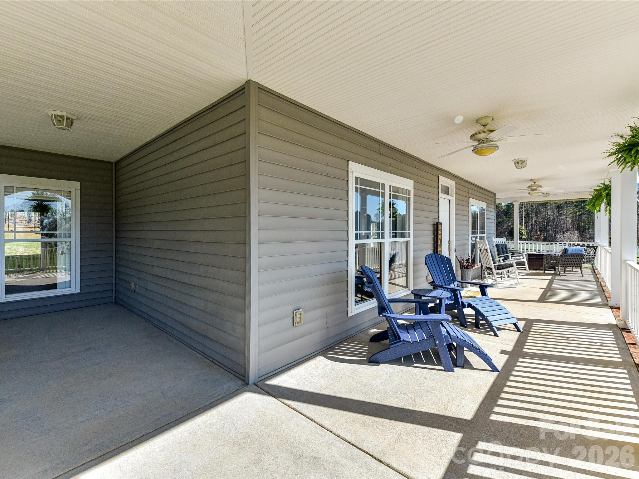 4566 Little Mountain Road Catawba, NC 28609 - Photo 12 of 47 a view of a patio with table and chairs potted plants with wooden floor