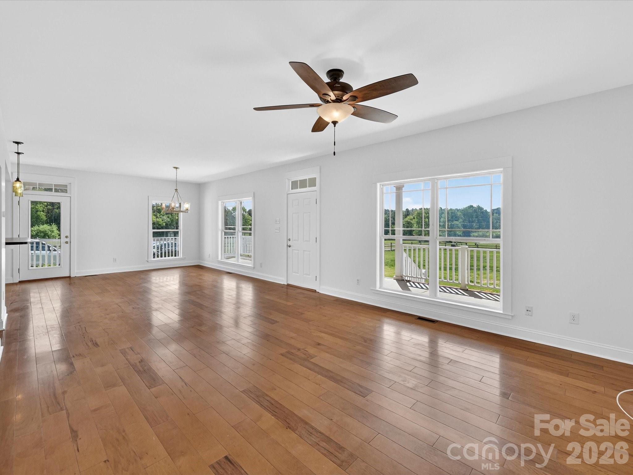 4566 Little Mountain Road Catawba, NC 28609 - Photo 24 of 47 a view of an empty room with wooden floor and a window