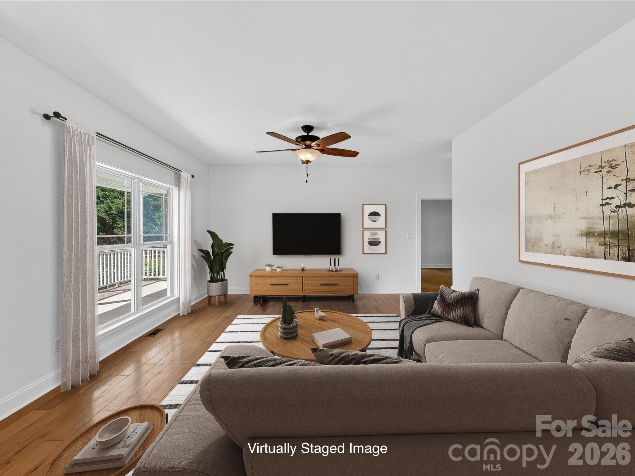 4566 Little Mountain Road Catawba, NC 28609 - Photo 25 of 47 a living room with furniture and a flat screen tv
