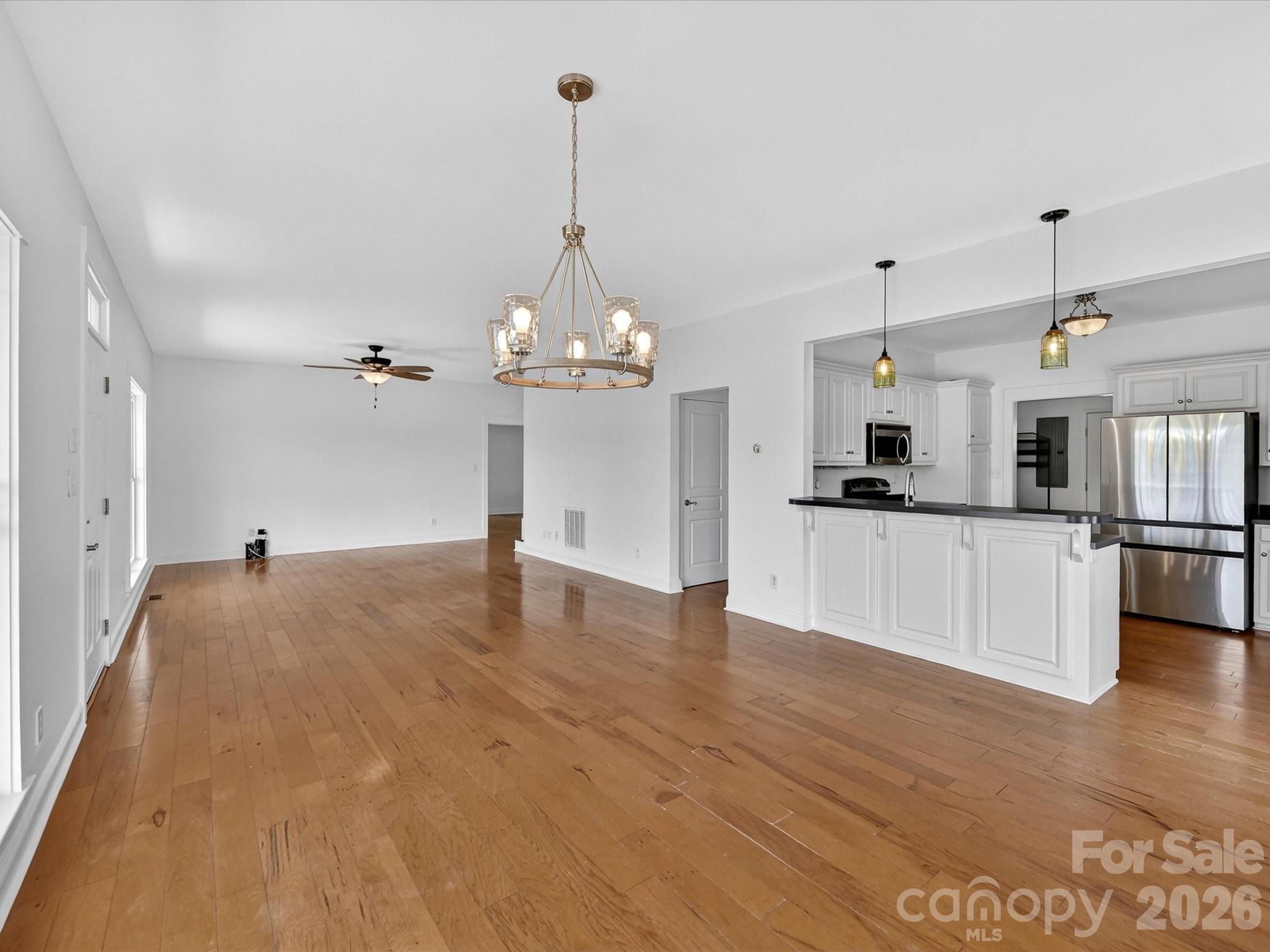 4566 Little Mountain Road Catawba, NC 28609 - Photo 26 of 47 a view of a kitchen with a sink dishwasher a kitchen counter top space and cabinets
