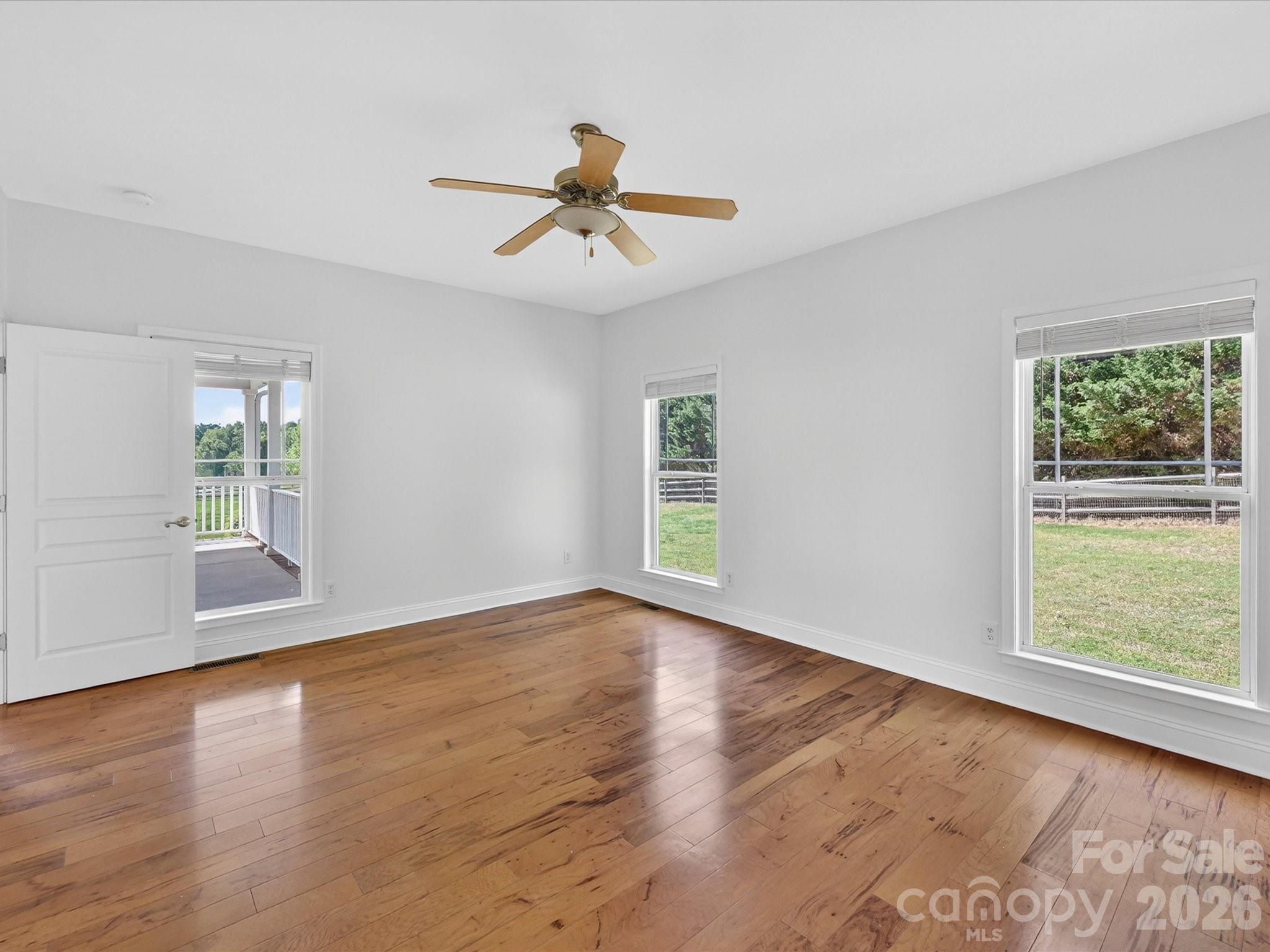 4566 Little Mountain Road Catawba, NC 28609 - Photo 35 of 47 a view of an empty room with wooden floor and a window