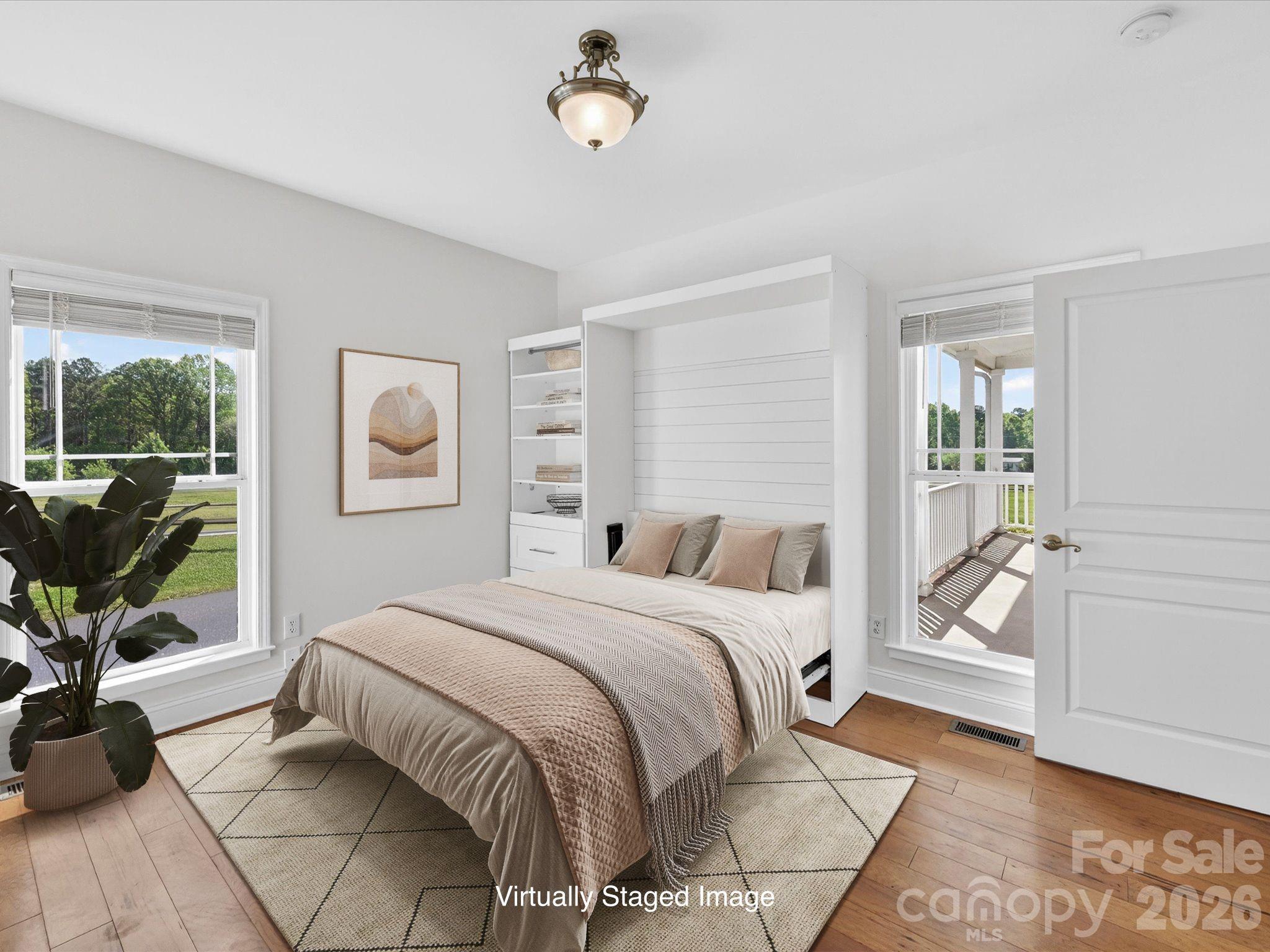 4566 Little Mountain Road Catawba, NC 28609 - Photo 40 of 47 a bedroom with a bed a table and chair