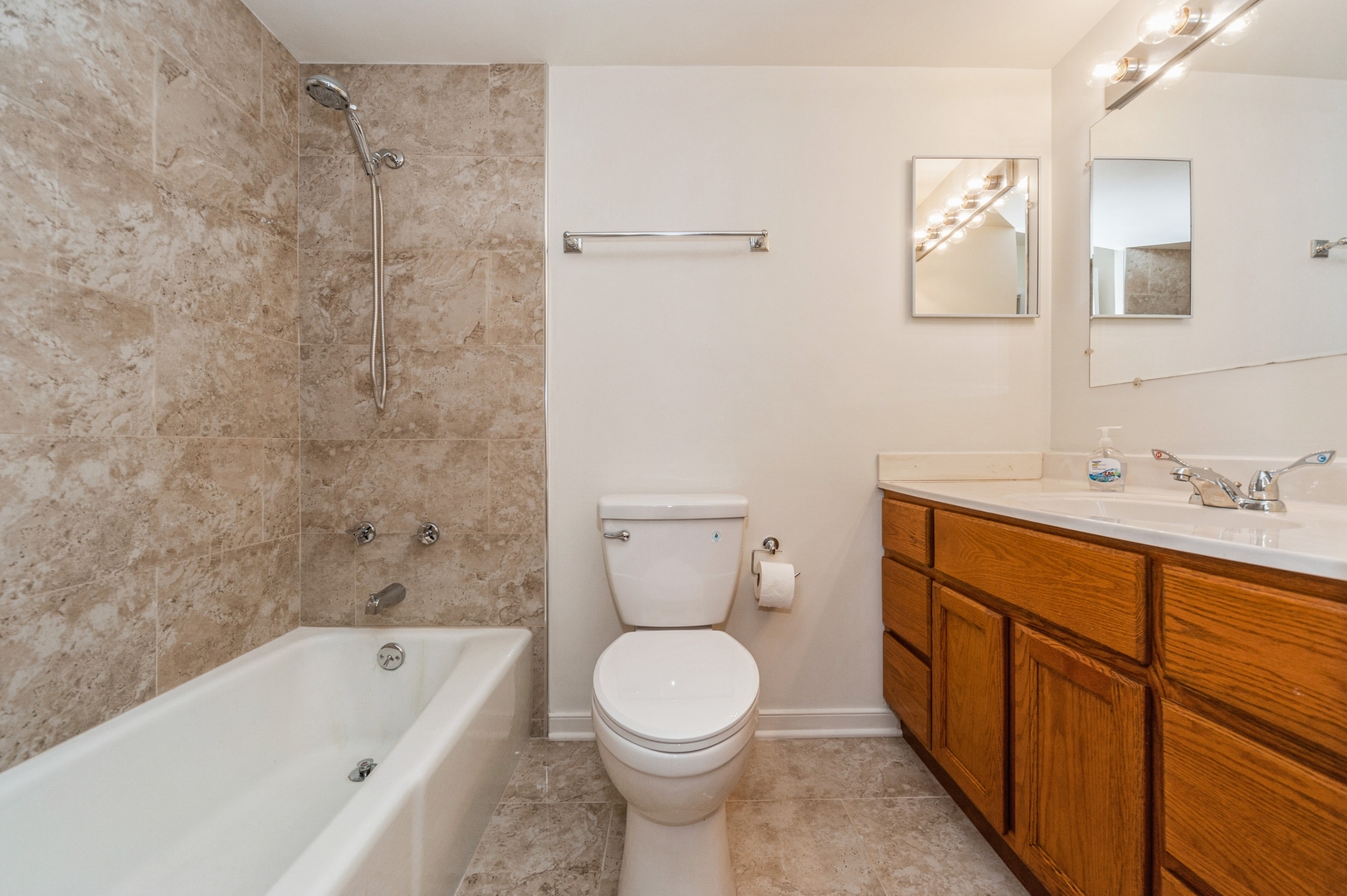 577 Fairway View Drive, Unit 2L Wheeling, IL 60090 - Photo 13 of 15 a bathroom with a sink a toilet and a bathtub