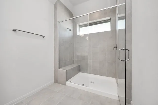 a bathroom with a bath tub and a shower