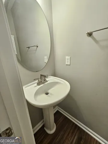 a bathroom with a sink a mirror and a toilet
