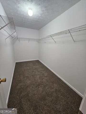 a view of a room with racks on the wall