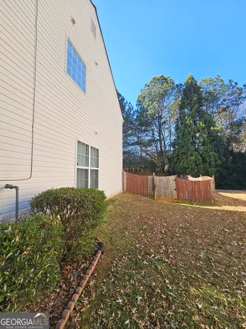 a house view with a backyard space