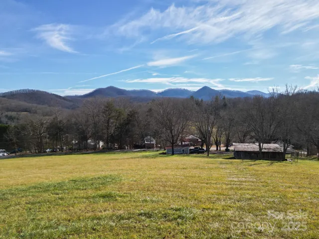 a view of a swimming pool with mountains in the background