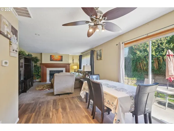 a view of a dining room with furniture window and outside view