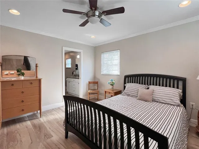 a bedroom with a bed and a dresser