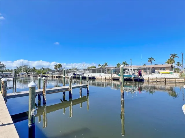 a view of a lake with outdoor seating