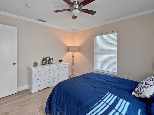 a bed room with a bed and a window