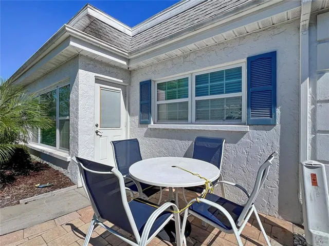a view of a patio in a backyard