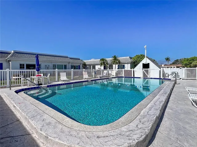 a view of a swimming pool with a balcony