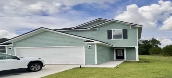 a house view with a garden space