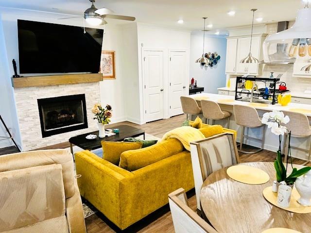 5236 Riden Court Buford, GA 30518 - Photo 12 of 41 a living room with furniture a flat screen tv and a fireplace