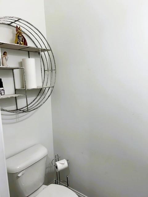 5236 Riden Court Buford, GA 30518 - Photo 18 of 41 a bathroom with a toilet and a mirror