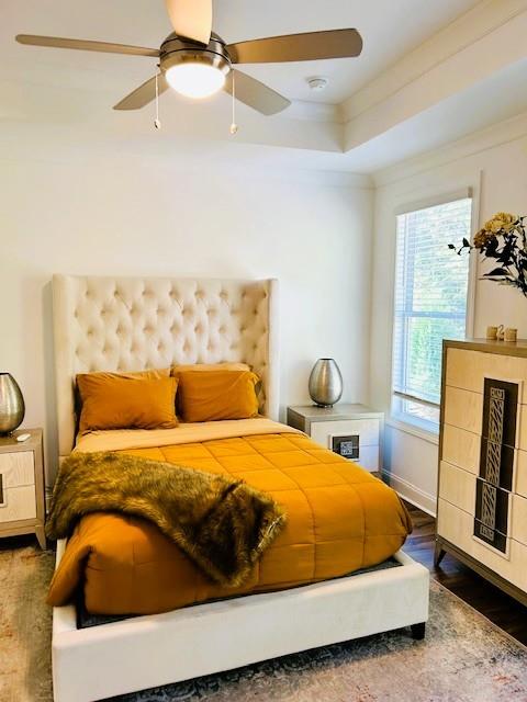 5236 Riden Court Buford, GA 30518 - Photo 29 of 41 a bedroom with a bed and wooden floor