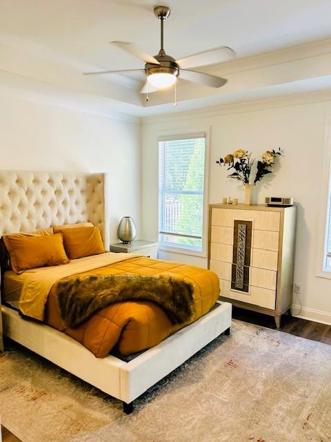 5236 Riden Court Buford, GA 30518 - Photo 30 of 41 a spacious bedroom with a bed and a chandelier
