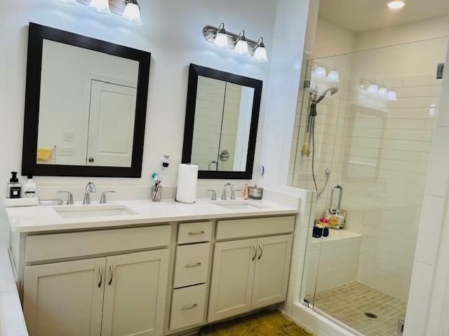 5236 Riden Court Buford, GA 30518 - Photo 31 of 41 a bathroom with a double vanity sink mirror and shower