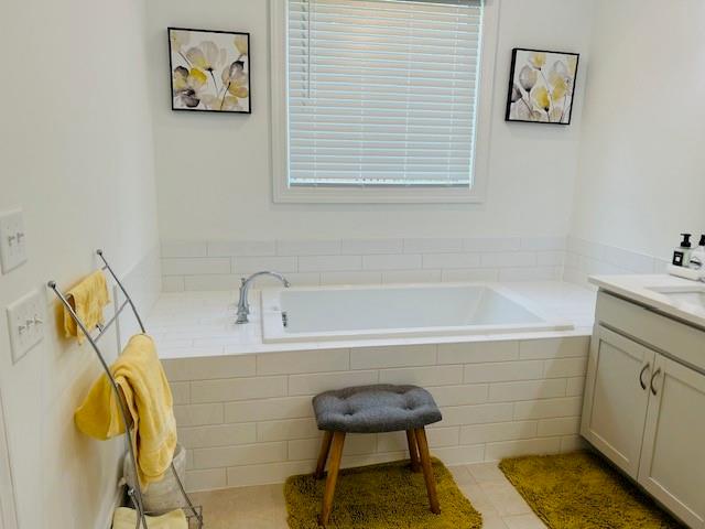5236 Riden Court Buford, GA 30518 - Photo 33 of 41 a bathroom with a bathtub and a shower