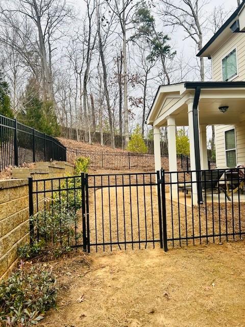 5236 Riden Court Buford, GA 30518 - Photo 36 of 41 a view of a wrought iron fences in front of house
