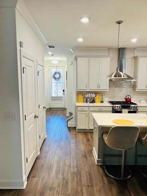 5236 Riden Court Buford, GA 30518 - Photo 5 of 41 a kitchen with stainless steel appliances a dining table chairs stove and cabinets